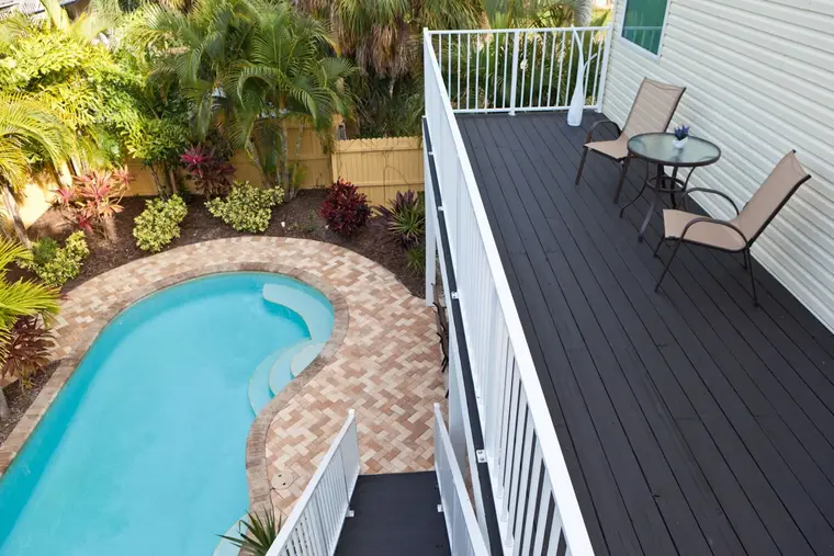 View from the master bedroom deck down to the private pool, Happy Island Cottage